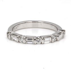 Half way band in platinum with channel set (5) rounds and basket set (4) emerald cut diamonds.  D0.58ct.t.w.  Size 7
