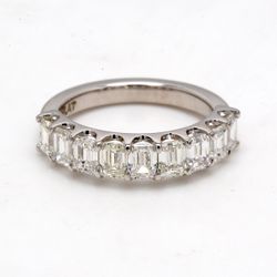 9-stone band in platinum with U-prong set emerald cut diamonds.  D1.79ct.t.w.  Size 4.5