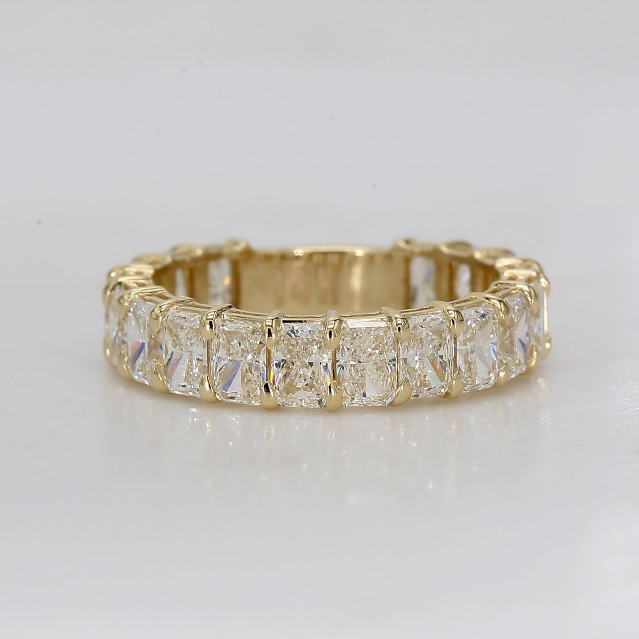 Band in 14K YG with double basket shared prong set (18) radiant diamonds.  D2.63ct.t.w.  Size 4
