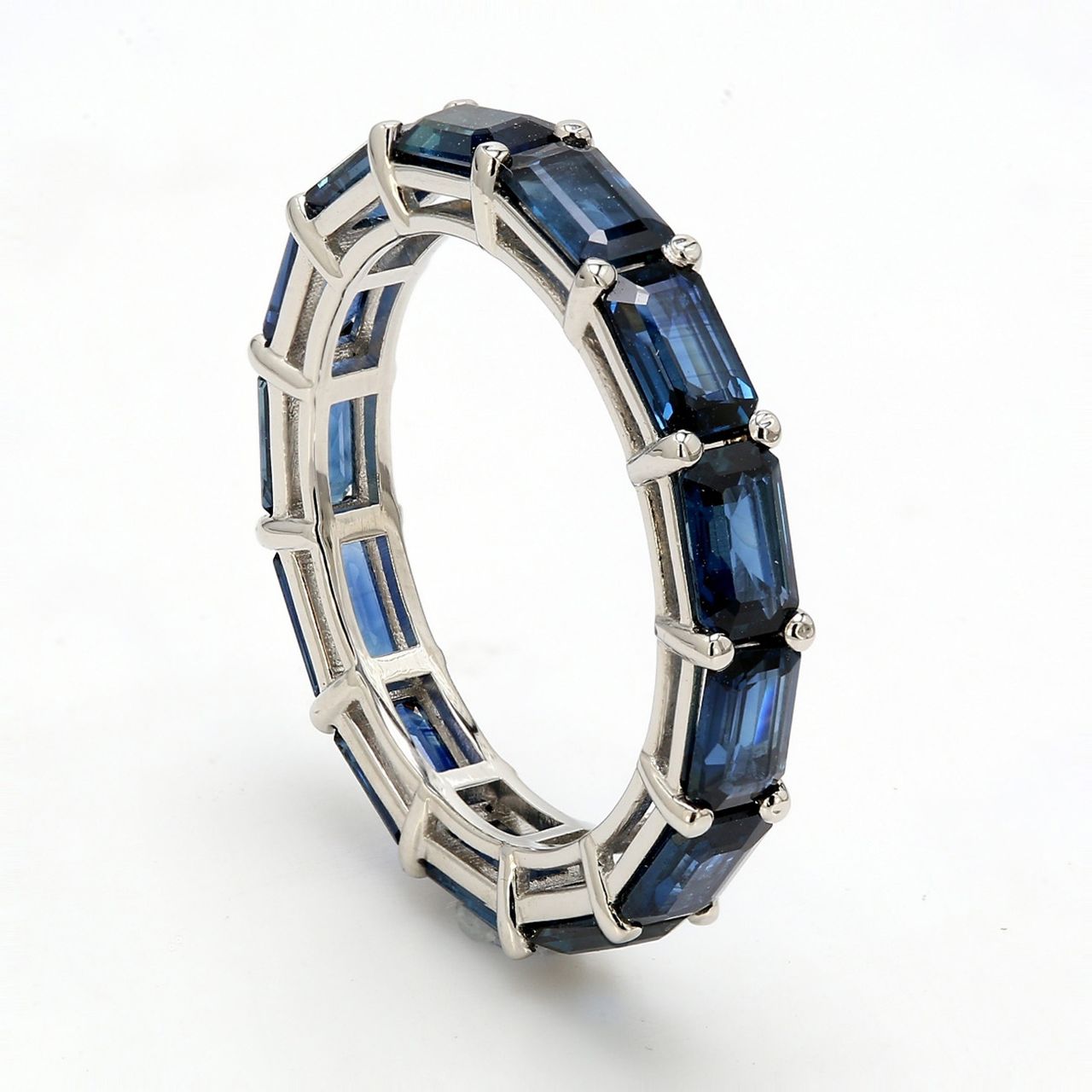 Eternity band in platinum with shared prong set sapphire.  Sapphires 4.14ct.t.w.