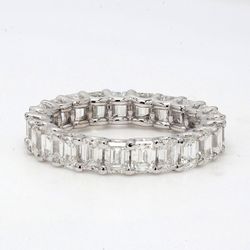 Eternity band with shared U-prong set (23) emerald cut diamonds.  D3.44ct.t.w.  Size 5