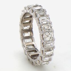 Eternity band in platinum with U-prong set (22) emerald cut diamonds.  D4.21ct.t.w.  Size 5