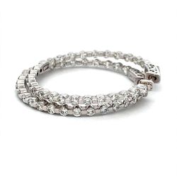 1.5' Inside out hoope earrings with 4-prong set (52) round diamonds & with special spring lock.  D2.30ct.t.w.
