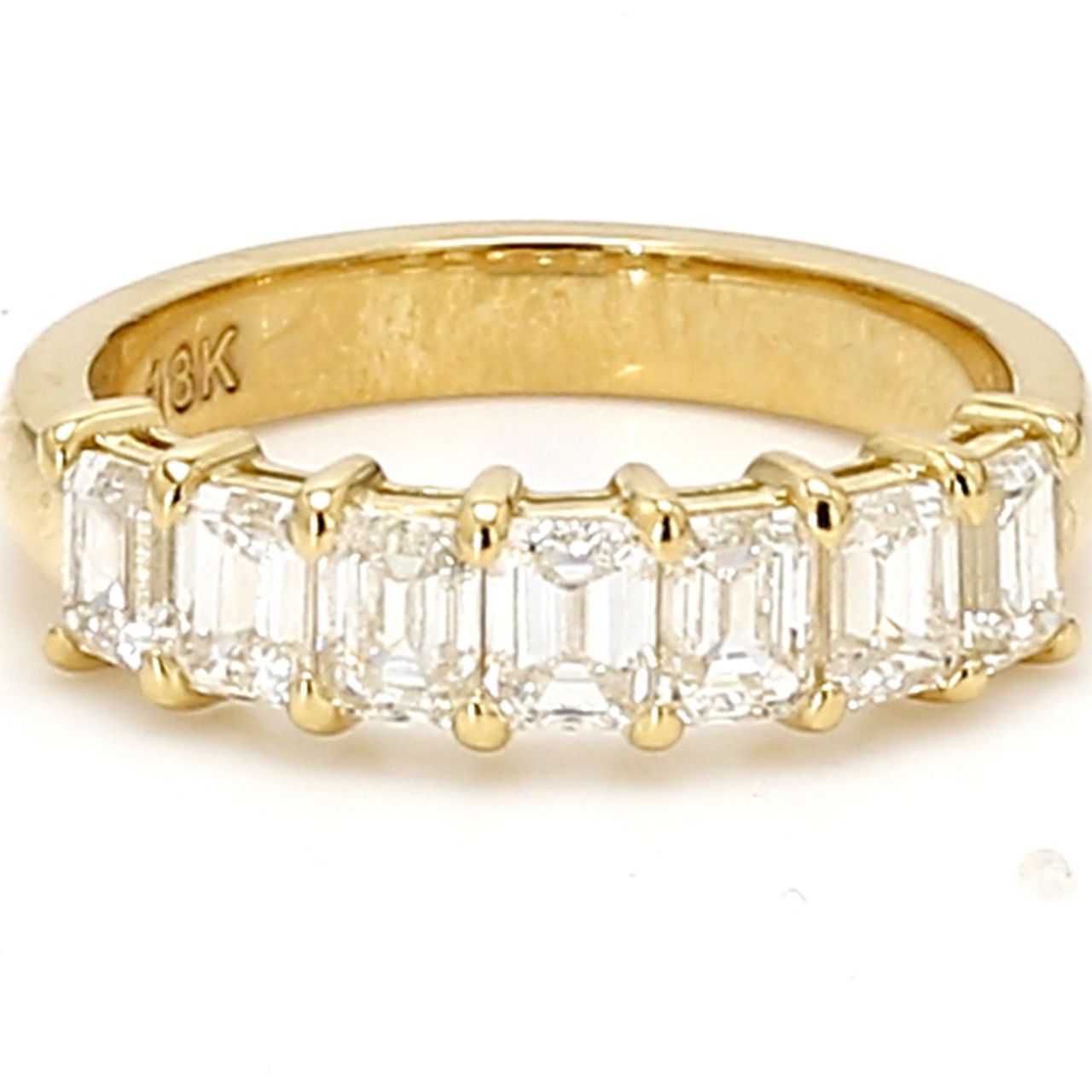7-stone band in 18K YG with shared prong set emerald cut diamonds.  D0.60ct.t.w.  Size 4.75