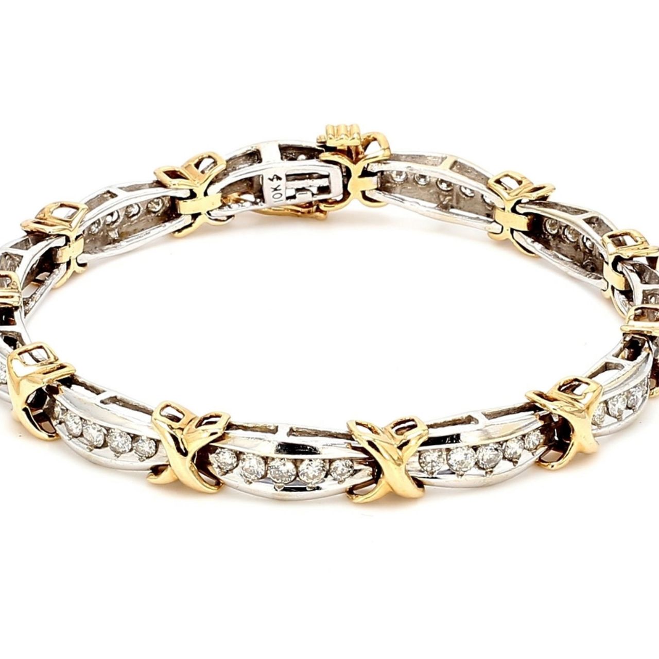 7' Bracelet in 10K two-tone with channel set round diamonds.  D3.00ct.t.w.