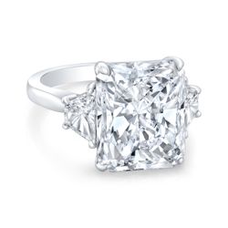 3-stone semi-mount in platinum with prong set trapezoid diamond sides.  D0.80ct.t.w.  Size 6.75