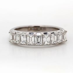 9-stone band in platinum with 4-prong set emerald cut diamonds.  D1.26ct.t.w.  Size 6
