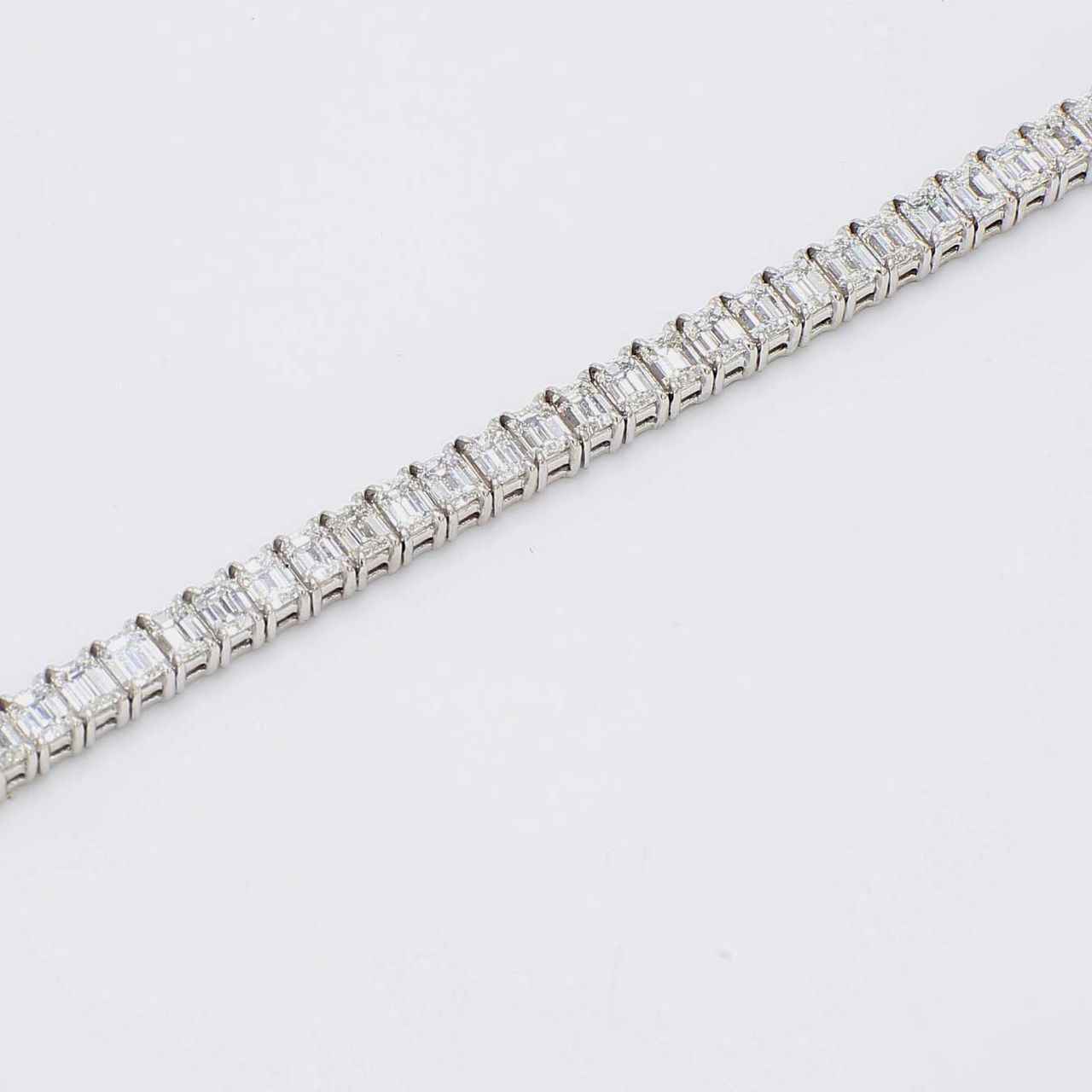 7' Tennis bracelet with 4-prong set (57) emerald cut diamonds.  D8.88ct.t.w.