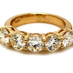 5-stone band in yellow gold with shared prong set round diamonds.  D2.98ct.t.w.  Size 6.25