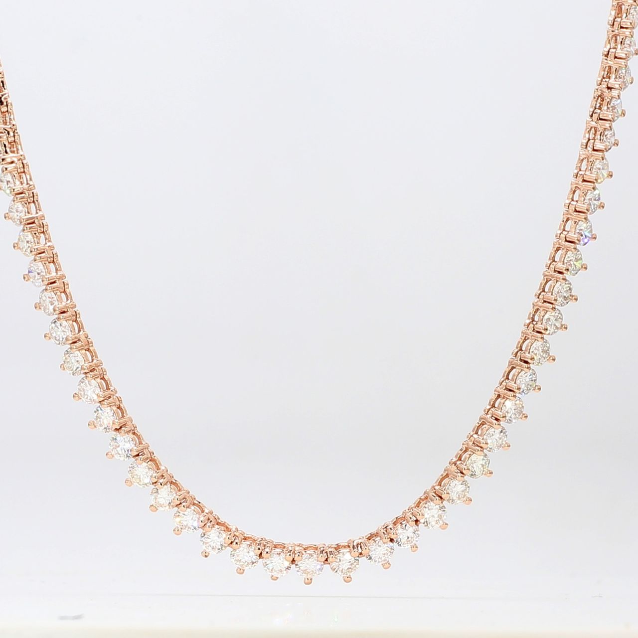 18' Tennis necklace in 14K RG with 3-prong set round diamonds.  D11.84ct.t.w.