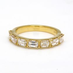 7-stone band in 18K YG with prong set emerald cut diamonds.  D1.33ct.t.w.  Size 5.5