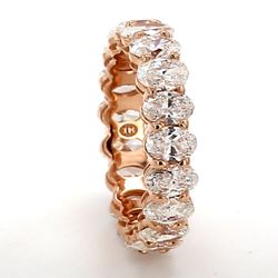 Eternity band in rose gold with basket prong set (19) oval diamonds.  D3.73ct.t.w.  Size 5