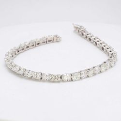 7' Tennis bracelet with basket prong set alternating oval & radiant cut diamonds.  D10.62ct.t.w.