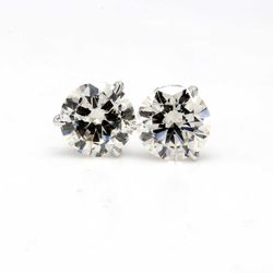 Screw back stud earrings with 3-prong set round diamonds.  D4.02ct.t.w.