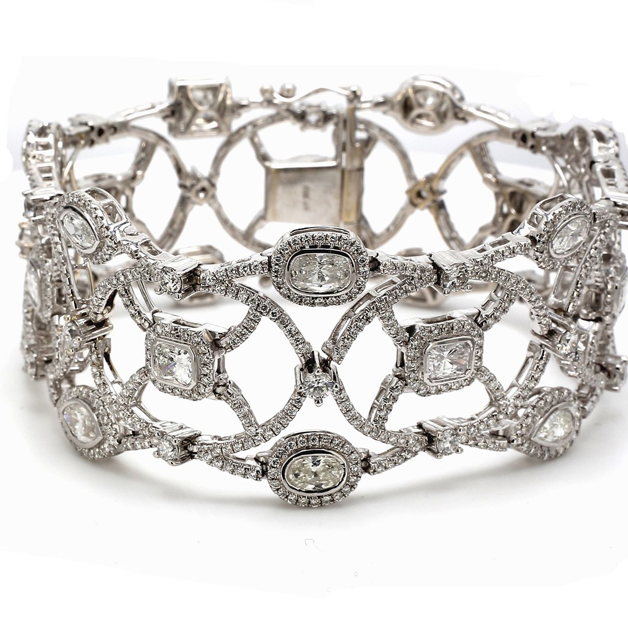 Halo designer bracelet in 18K WG with prong set rounds around fancy shaped diamond center stones.  D15.53ct.t.w.
