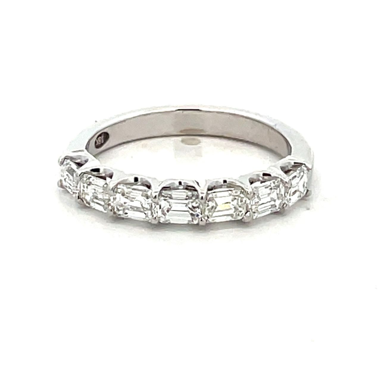 7-stone band east west style in 18K WG with prong set emerald cut diamonds.  D0.99ct.t.w.  Size 5