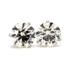 Screw back stud earrings with 3-prong set GIA certified L/SI2 and USA certified J/SI2 round diamonds.  D4.00ct.t.w.