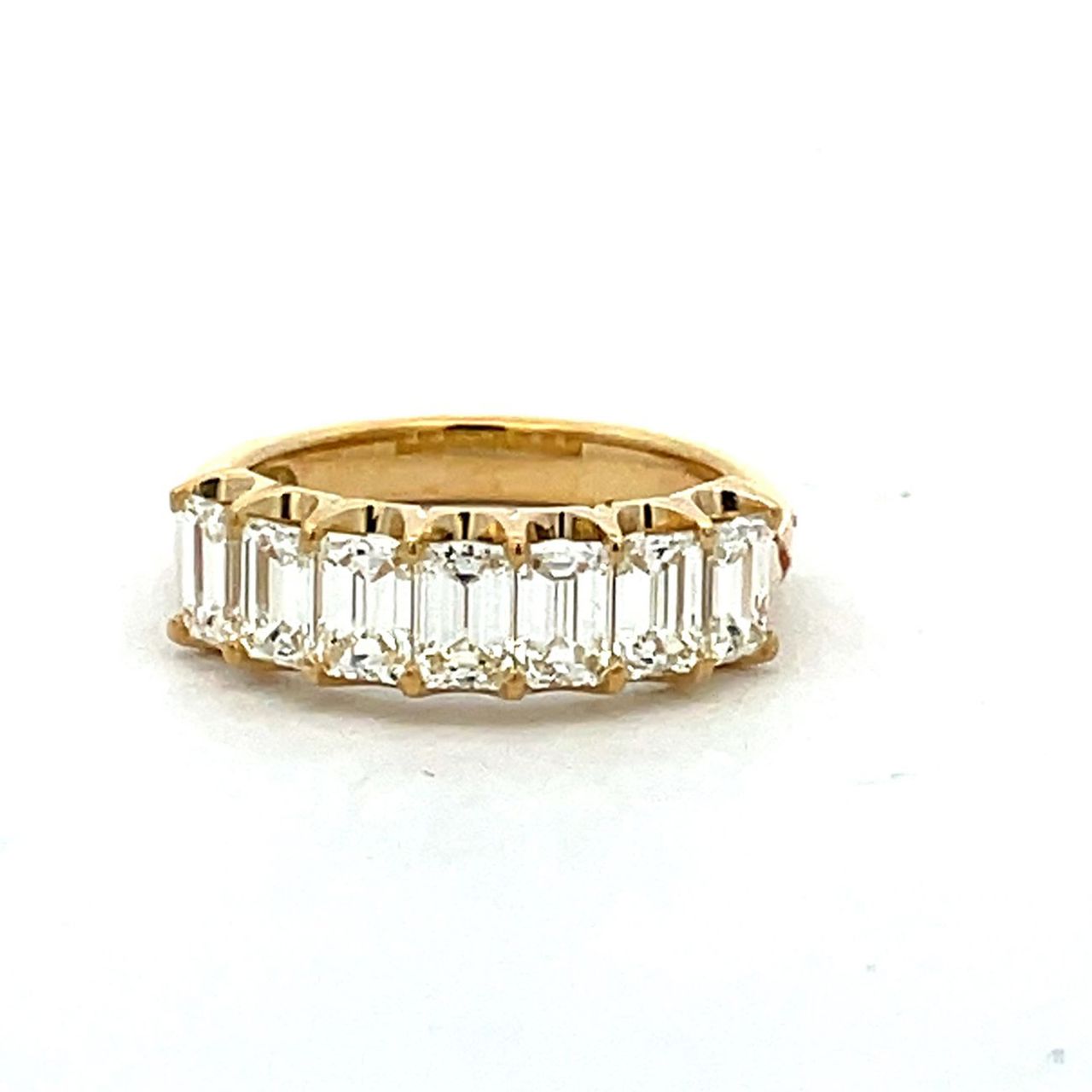 7-stone band in 18K YG with U-prong set emerald cut diamonds.  D1.53ct.t.w.  Size 5