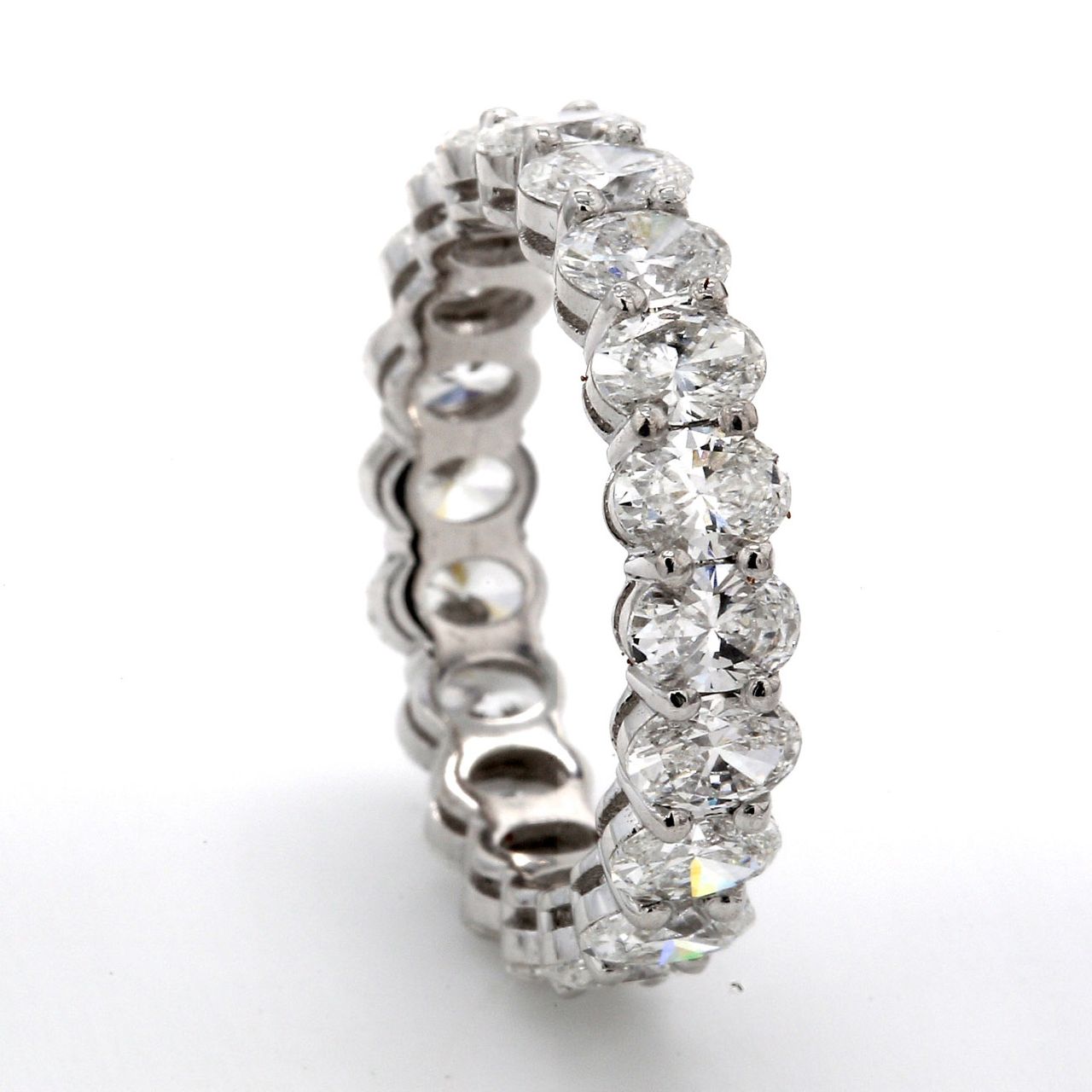 Eternity band in platinum with basket prong set (20) oval cut diamonds.  D3.24ct.t.w.  Size 5