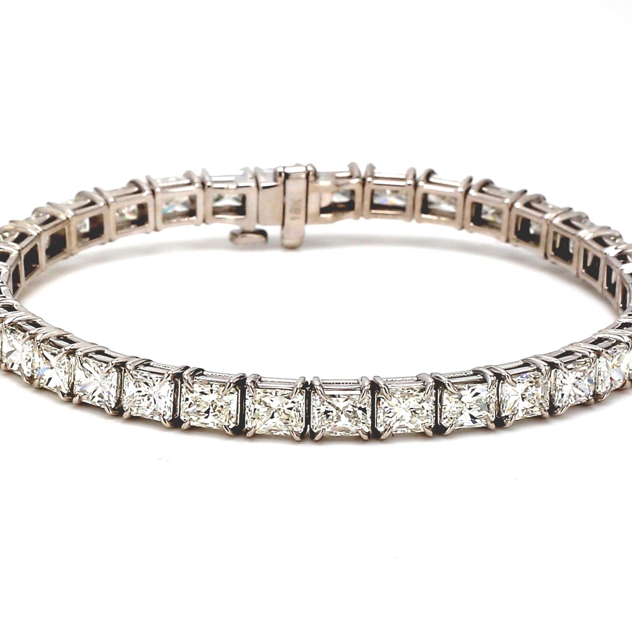 6' Tennis bracelet east to west style with basket prong set (35) radiant cut diamonds.  D10.78ct.t.w.