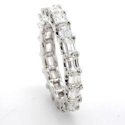 Eternity band east to west style with shared U-prong set (18) emerald cut diamonds.  D2.81ct.t.w.  Size 6