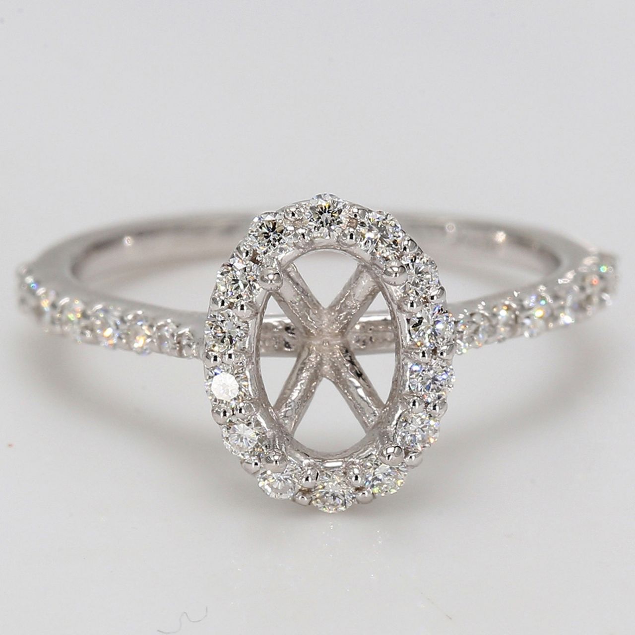 Halo semi-mount with shared prong set round diamonds.  D0.50ct.t.w.