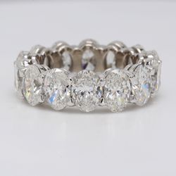 Eternity band in platinum with shared prong basket set GIA certified E-G/SI1-2 (14) oval diamonds.  D9.94ct.t.w.  Size 7
