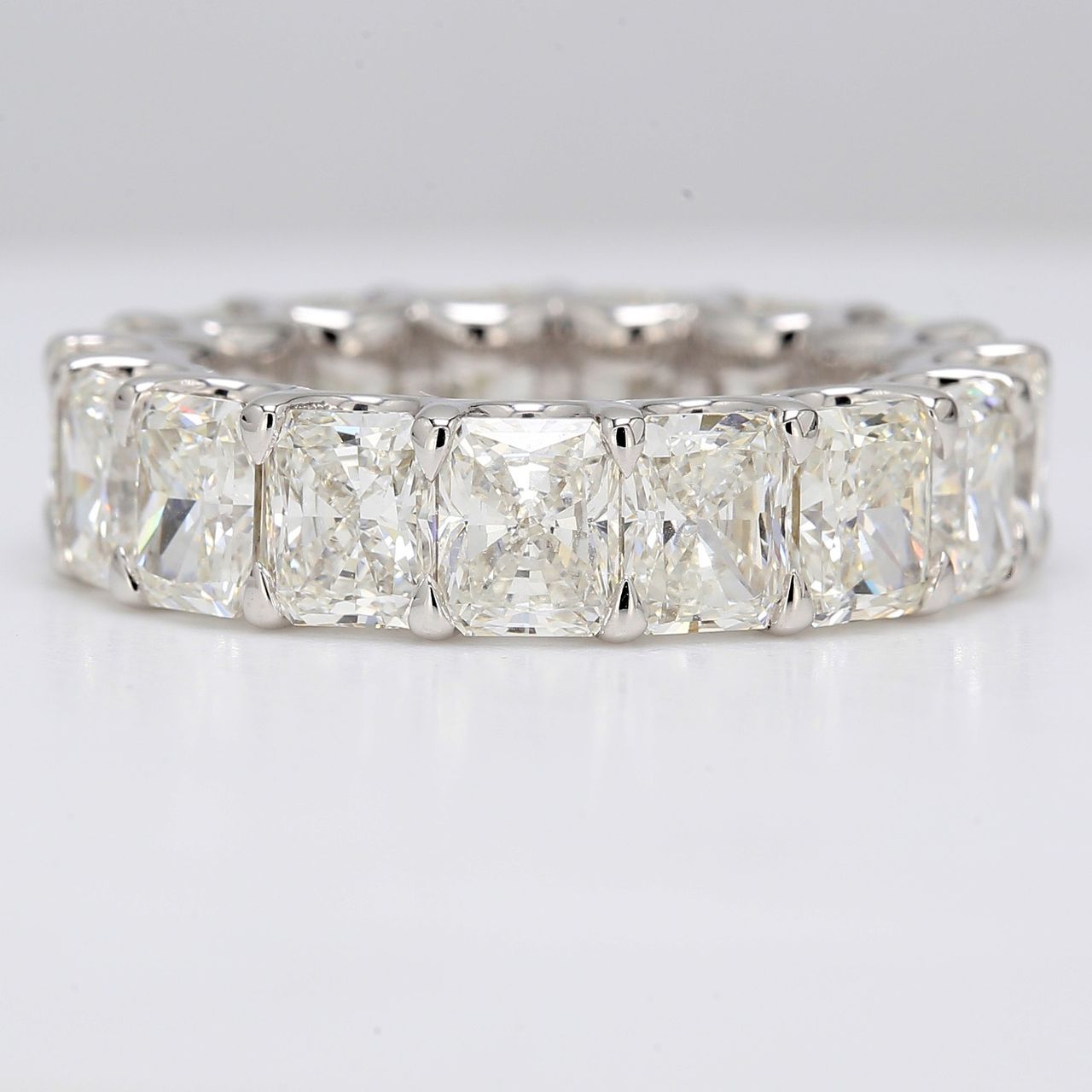 Eternity band in platinum with U-prong set G-H/VVS-VS (17) radiant cut diamonds.  D12.78ct.t.w.  Size 8.25