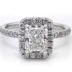 Halo ring in platinum with pre-set rounds around GIA certified E/SI1 radiant diamond center.  D2.47ct.t.w.  (Center 2.01ct.)