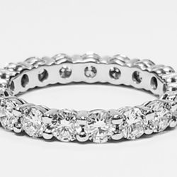 Eternity band in platinum with shared prong set (19) round diamonds.  D1.89ct.t.w.  Size 5