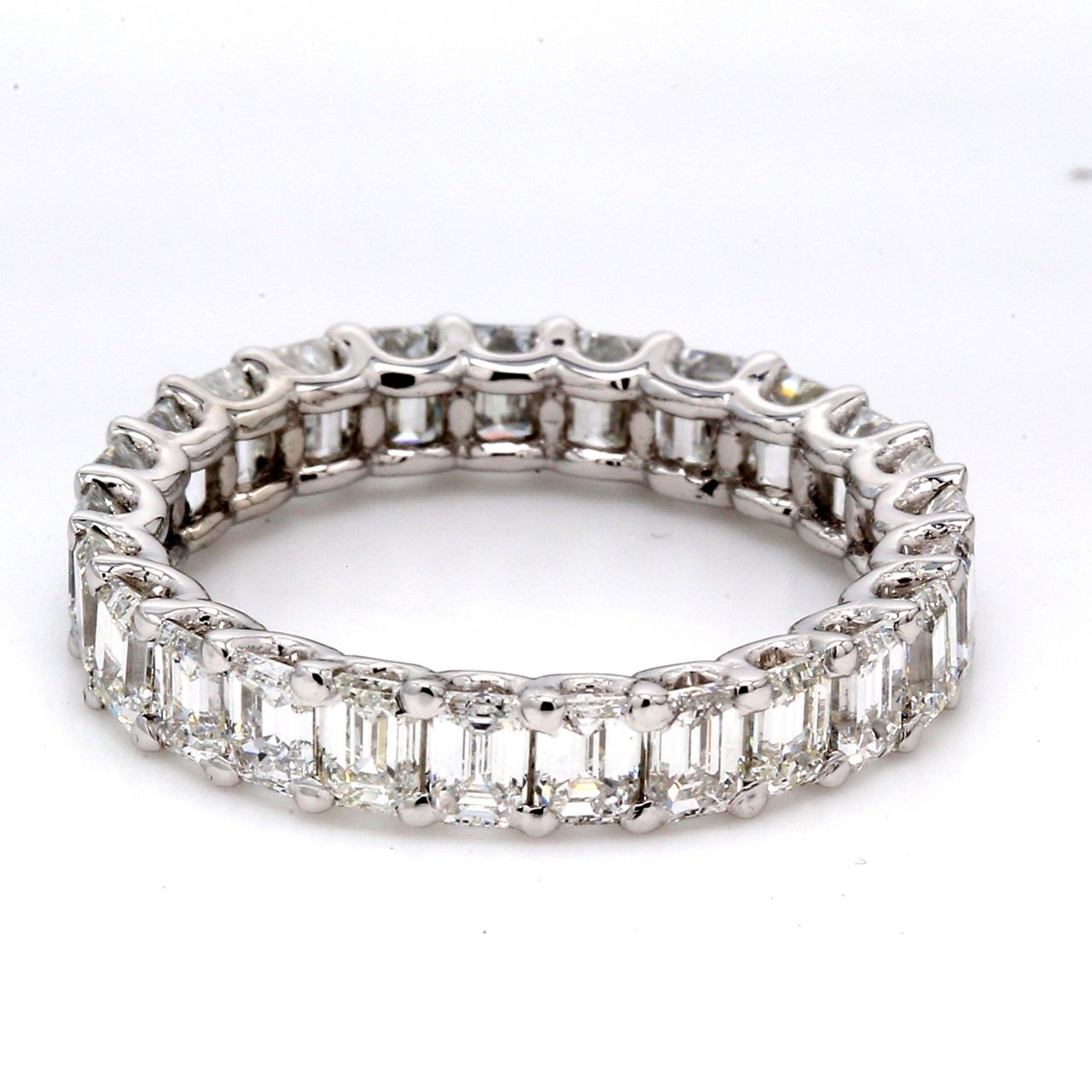 Eternity band in platinum with U-prong set (25) emerald cut diamonds.  D3.75ct.t.w.  Size 6