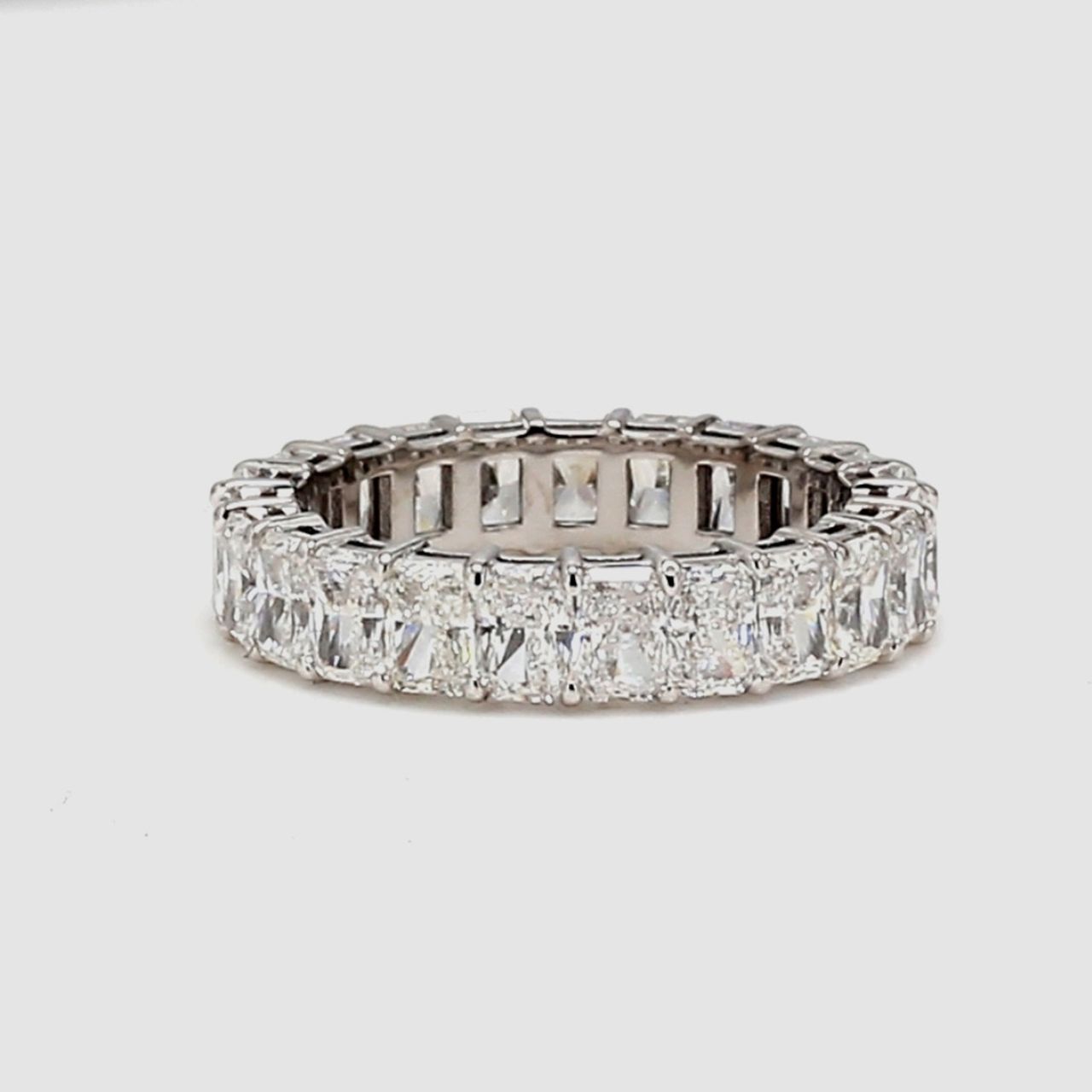 Eternity band with shared basket prong set (23) radiant cut diamonds.  D3.65ct.t.w.  Size 5