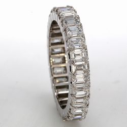 Eternity band in 18K WG with prong set (28) emerald cut diamonds.  D2.83ct.t.w.  Size 5.25