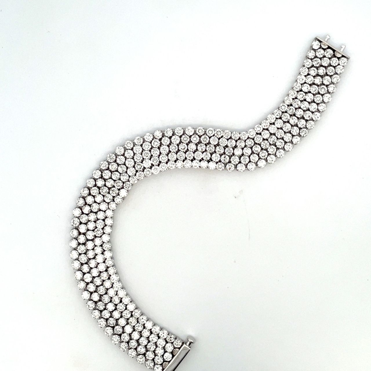 7' 5-row bracelet in 18K WG with soft links, 2 and 3-prong set round diamonds.  D19.47ct.t.w.