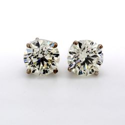 Screw back stud earrings with prong set USA certified J-K/SI2  round diamonds.  D4.02ct.t.w.