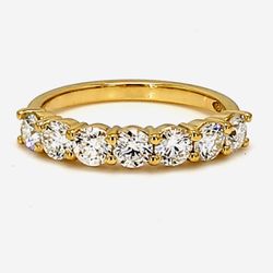7-stone band in 18K YG with shared prong set round diamonds.  D0.99ct.t.w.  Size 5