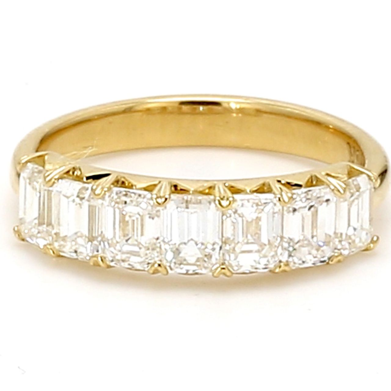 7-stone band in 18K YG with prong set emerald cut diamonds.  D1.66ct.t.w.  Size 5