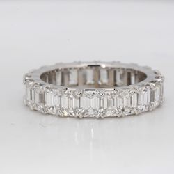 Eternity band in platinum with shared prong basket set emerald cut diamonds.  D4.90ct.t.w.  Size 5.5