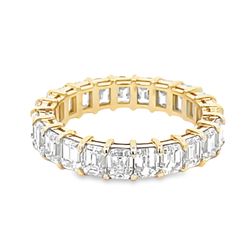 Eternity band in 18K YG with open basket prong set (23) emerald cut diamonds.  D4.14ct.t.w.  Size 6