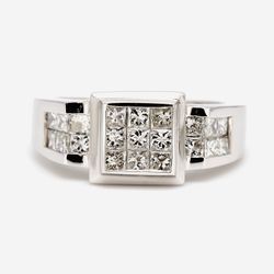 Ring with 3x3 princess cuts on the center & princess cut diamond on the sides.  D1.20ct.t.w.