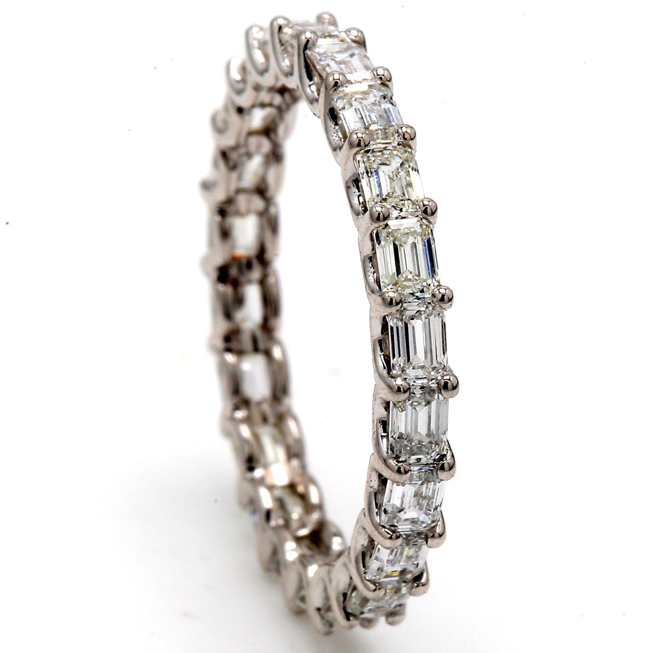 Eternity band east to west style in 18K WG with U-prong set (23) emerald cut diamonds.  D2.00ct.t.w.  Size 7