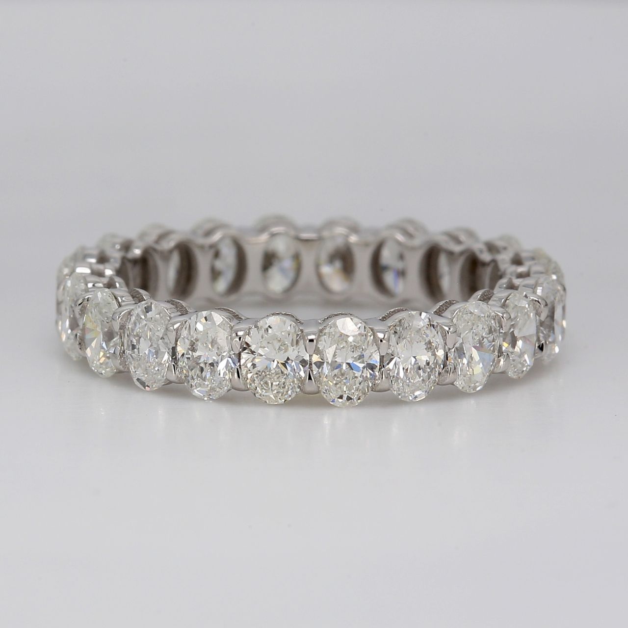 Eternity band in platinum with shared prong double basket set (22) oval diamonds.  D3.26ct.t.w.   Size 6.75