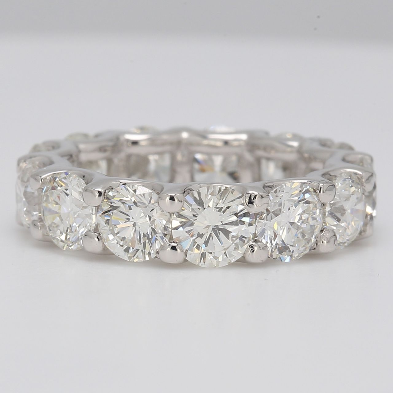 Eternity band in platinum with U-prong set round diamonds.  D6.11ct.t.w.  Size 5.25