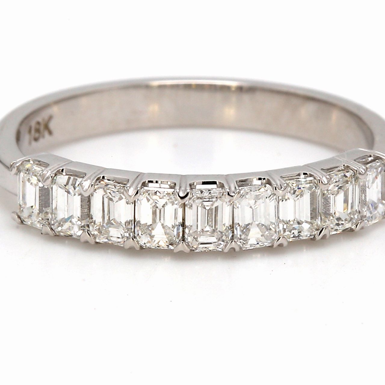 9-stone band in 18K WG with prong set emerald cut diamonds.  D0.86ct.t.w.  Size 6