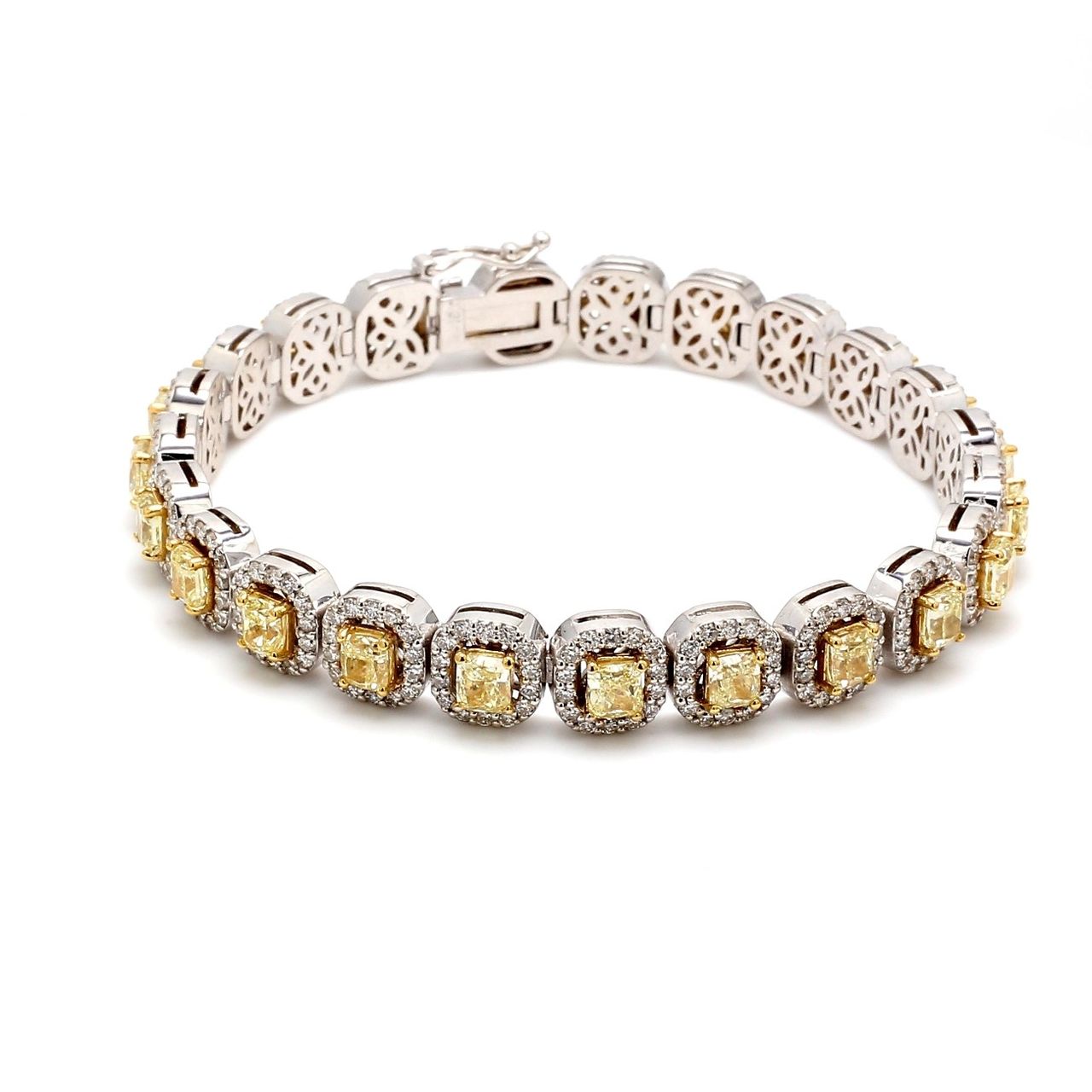 7' Halo tennis bracelet in 18K WG with prong set rounds around (23) radiant cut diamond centers.  D11.11ct.t.w.