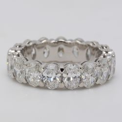 Eternity band in platinum with shared prong basket double wire set G-H/SI (15) oval cut diamonds.  D8.01ct.t.w.  Size 6