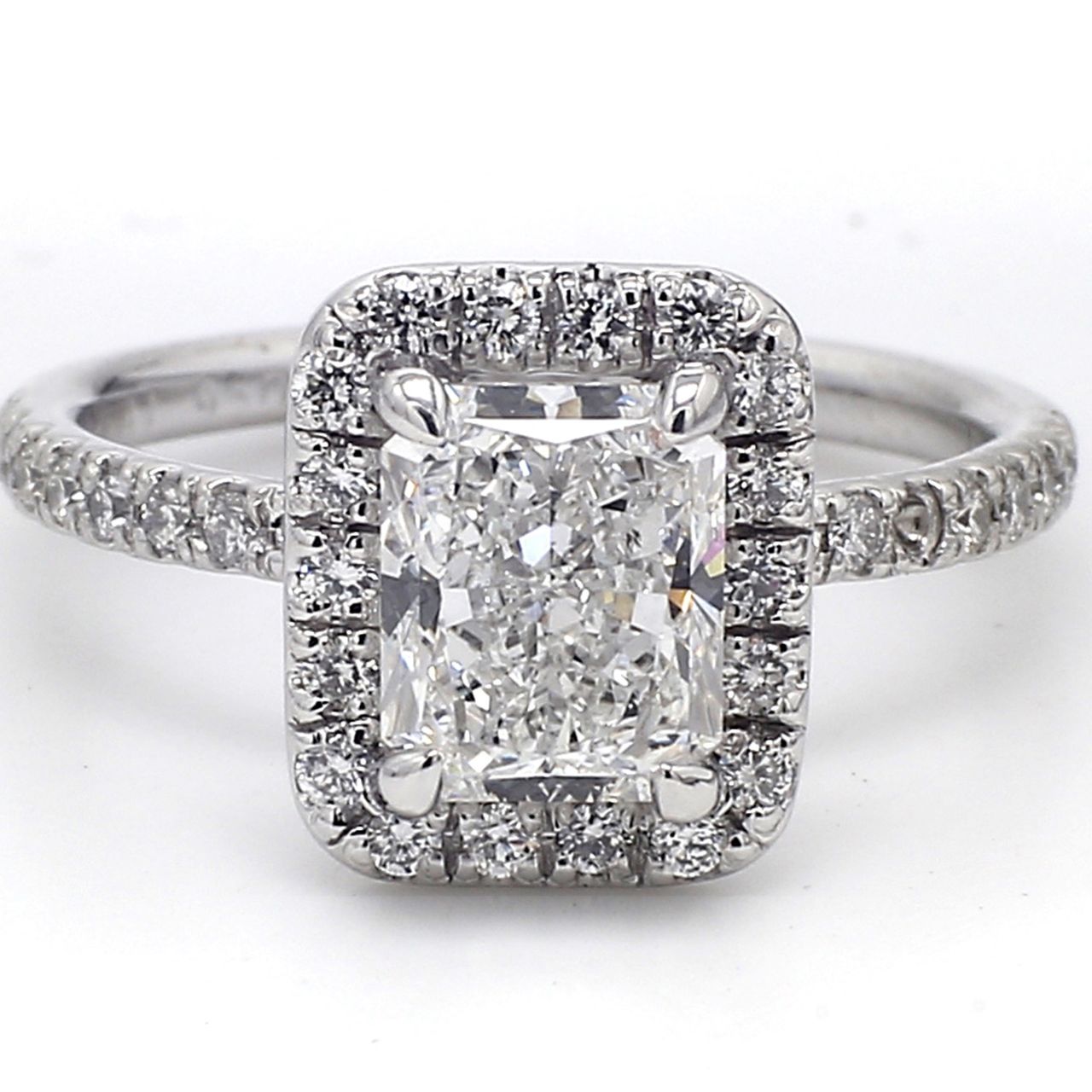 Halo ring in platinum with pre-set rounds around GIA certified E/SI1 radiant diamond center.  D2.47ct.t.w.  (Center 2.01ct.)
