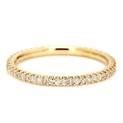 Eternity band in 18k yellow gold with shared U-prong set round diamonds.  D0.44ct.t.w.