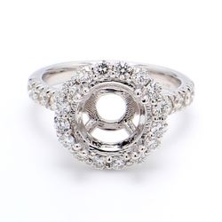 Halo semi-mount with U-prong set round diamonds.  D0.82ct.t.w.  Size 5.75