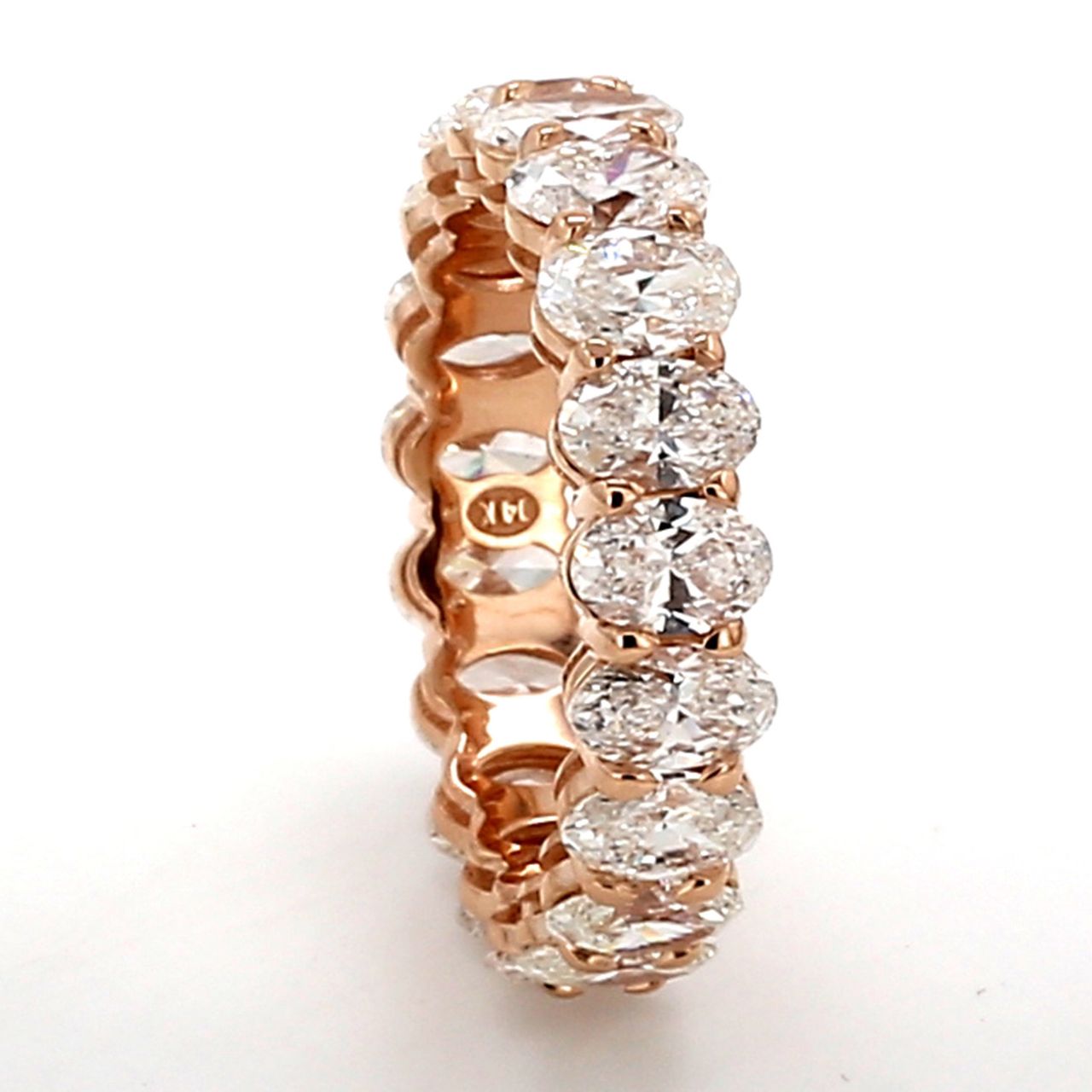 Eternity band in rose gold with basket prong set (19) oval diamonds.  D3.73ct.t.w.  Size 5